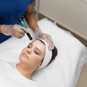 person-getting-micro-needling-beauty-treatment